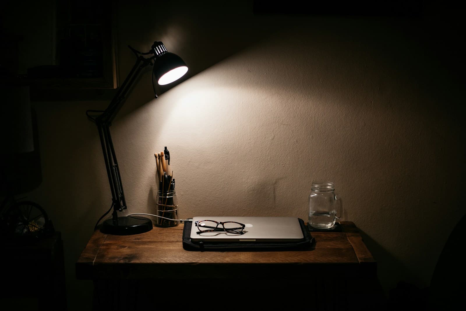 Black desk lamp on a wooden table